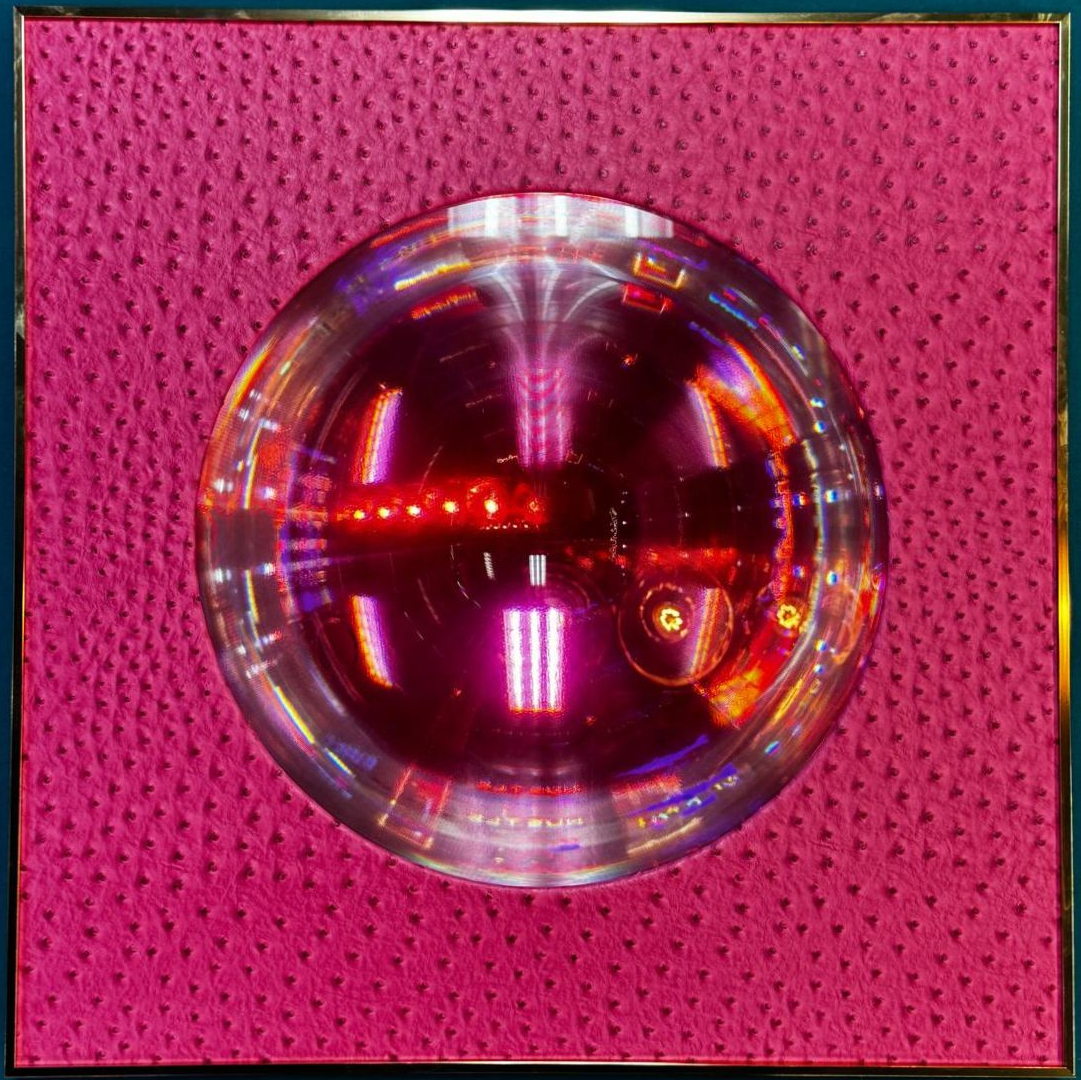 Spirit Orb – Pink Blush (24" x 24") by Paul Makovski, a 3D optical illusion artwork featuring a reflective orb set against pink ostrich-textured leather.